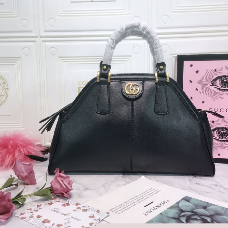 G*u*i top handle bags